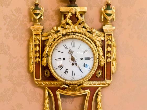 clock with gold in the castle